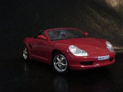 Porsche Boxster Cabriolet 1998 de couleur rouge, intrieur noir (Vue ct passager)